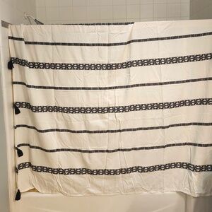 Lovely shower curtain 72 X 72 black & white with tassels. 12 black hooks